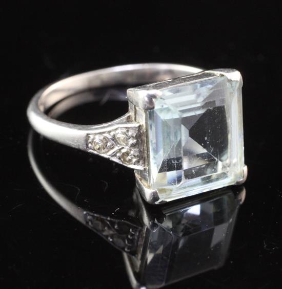 A mid 20th century platinum, aquamarine and diamond ring, size J.